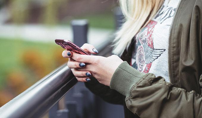 A girl holding a cell phone